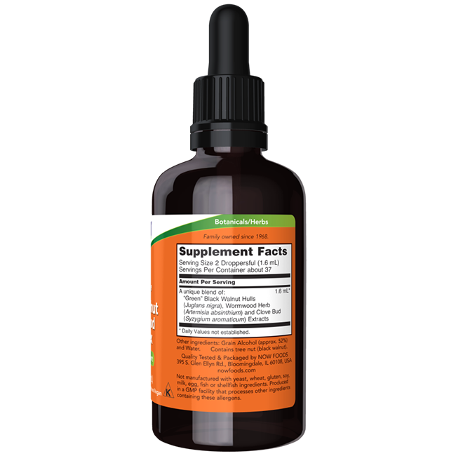 A dark amber glass bottle with a dropper cap, labeled "Supplement Facts" and "Botanicals/Herbs," contains various herbal extracts, featuring the Green Black Walnut Wormwood Complex 2 fl. oz. Liquid by Now Foods.