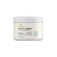 Thumbnail for A jar of Swanson Vitamin K Cream with Menaquinone-7 2 fl oz (59 ml), labeled as softening and paraben-free, contains aloe vera, cocoa butter, and essential oils. This Vitamin K Cream with Menaquinone-7 2 fl oz (59 ml) is designed to nourish your skin.