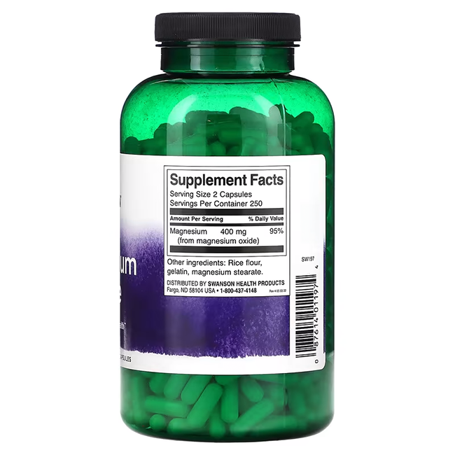 A green bottle labeled "Swanson Magnesium Oxide 200 mg 500 Capsules" supports bone health and enzyme reactions, featuring supplement facts and ingredients.