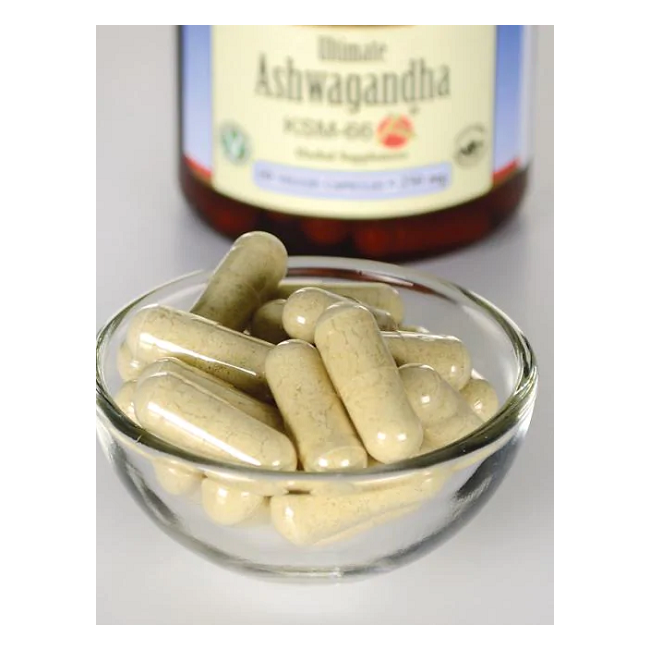 A small glass bowl with beige capsule-shaped pills is in front of a blurred Swanson bottle labeled "Ashwagandha - KSM-66 - 250 mg 60 vege capsules," featuring renowned adaptogenic herbs that promote balance and well-being.