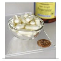 Thumbnail for A small glass bowl holds white capsules, likely from Swanson's Pregnenolone 50 mg Super Strength. A penny is nearby, and a supplement bottle with a blurred label is visible in the background.