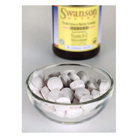 Thumbnail for A glass bowl filled with round white tablets is in front of a blurred Swanson Vitamin B-12 - 1000 mcg 60 tabs Hydroxycobalamin bottle, suggesting its essential role in energy production.