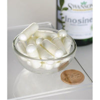 Miniatura de Uma taça de comprimidos brancos ao lado de um frasco de Swanson Inosine - 500 mg 60 vege capsules.