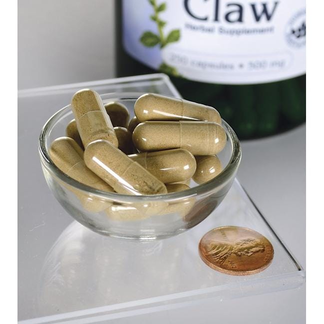 Uma taça de Swanson's Cats Claw - 500 mg 250 cápsulas ao lado de um frasco.