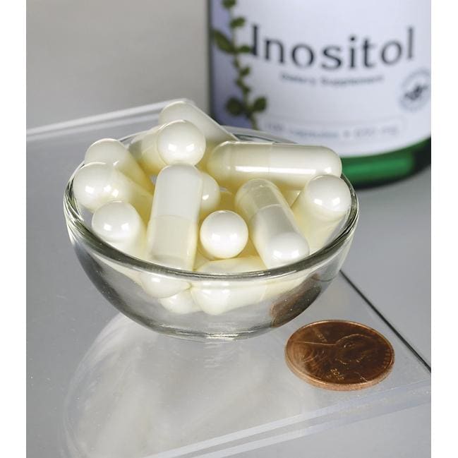 Swanson Inositol - 650 mg 100 cápsulas numa tigela ao lado de um frasco de Swanson Inositol.