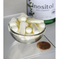 Miniatura de Swanson Inositol - 650 mg 100 capsules numa tigela ao lado de um frasco de Swanson Inositol.