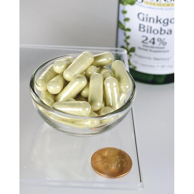 Swanson Extrato de Ginkgo Biloba 24% - 60 mg 120 cápsulas numa tigela ao lado de uma moeda.
