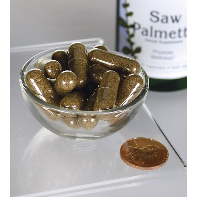 SwansonSaw Palmetto - 540 mg 100 cápsulas, um suplemento popular para o apoio da próstata, é apresentado numa taça ao lado de uma moeda.