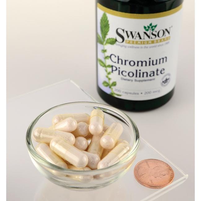 Uma taça de Swanson Chromium Picolinate - 200 mcg 200 capsules ao lado de um cêntimo.