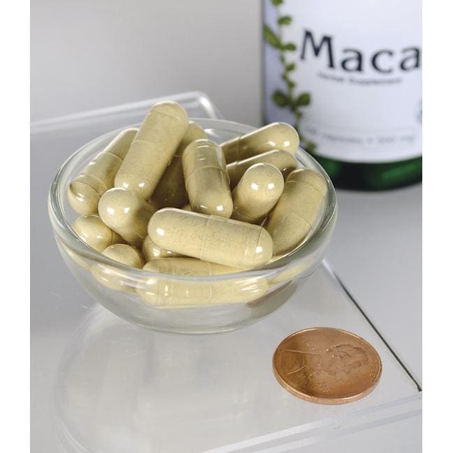 Swanson Maca - 500 mg 100 cápsulas numa taça ao lado de uma garrafa de Swanson Maca.