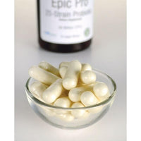 Miniatura de Uma taça de comprimidos brancos ao lado de um frasco de Swanson's Epic Pro 25-Strain Probiotic - 30 vege capsules.