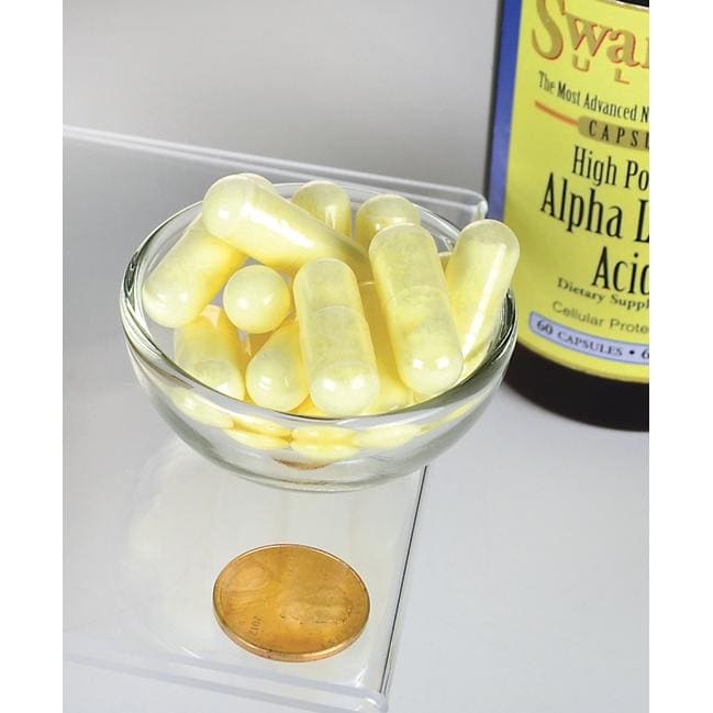 Um frasco de Swanson Alpha Lipoic Acid - 600 mg 60 capsules com uma moeda ao lado.