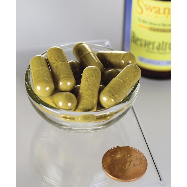 A bowl of Swanson Resveratrol - 100 mg 30 capsules providing antioxidant protection next to a bottle of olive oil for cardiovascular wellness.