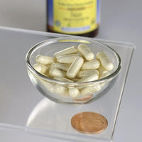 Miniatura de Uma taça de Swanson Folate 5-MTHF - 400 mcg 30 veggie capsules ao lado de uma moeda.