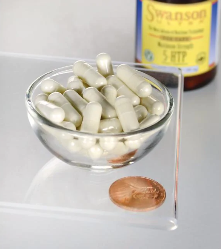 Uma taça de Swanson 5-HTP Maximum Strength 200 mg 60 Capsules ao lado de um cêntimo.