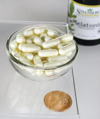 Miniatura de Uma taça de Swanson Melatonin - 3 mg 120 capsules ao lado de uma moeda.