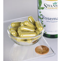 Miniatura de Uma tigela com um frasco de Swanson Rosemary - 400 mg 90 capsules, uma erva rica em antioxidantes, e uma moeda.
